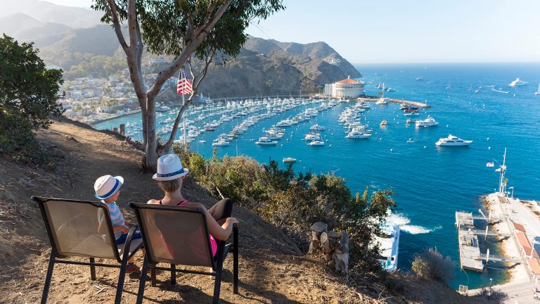 Catalina Island, Chanel Islands National Park, California, Casino View. Pier View. Mother and Son. Family. USA Flag. Boats.