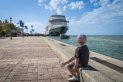 Key West, FL. Cruise Ship, Port. Sunset Pier. Boy Sitting and watching.