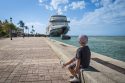 Key West, FL. Cruise Ship, Port. Sunset Pier. Boy Sitting and watching.